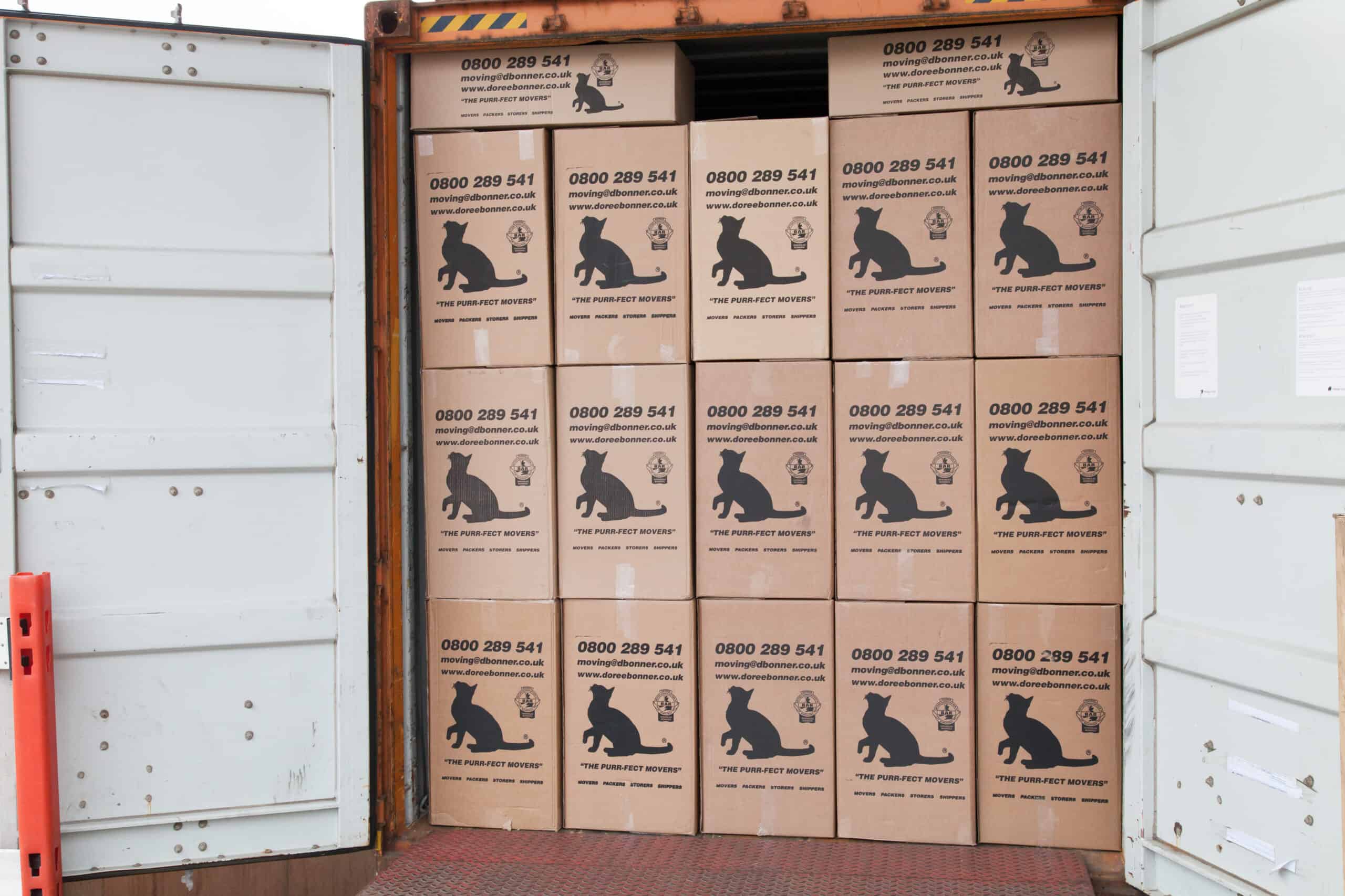 Doree Bonner boxes in a shipping container